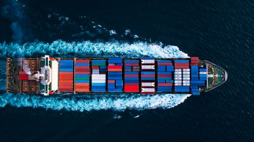 aerial-top-view-full-speed-container-ship-deep-blue-sea-cargo-logistics-import-export-transportation-international-asia-pacific